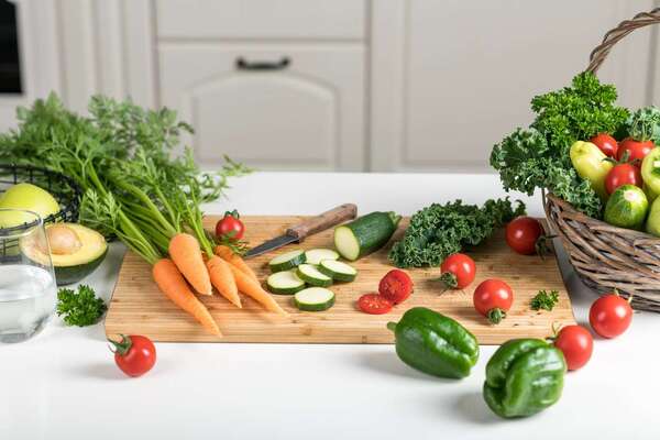Fresh vegetables and natural ingredients arranged on a clean table